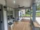 Relaxing covered porch with comfortable seating and ceiling fan at 1841 Bayberry Sw Dr, Atlanta, GA 30311