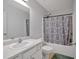 Bright bathroom featuring a tub with shower and stylish patterned curtain at 2793 Saddle Horn, Snellville, GA 30039