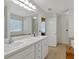 Bright bathroom featuring double sinks, white cabinets and a large mirror at 2793 Saddle Horn, Snellville, GA 30039