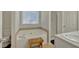Bathroom with a soaking tub, shower and stool featuring painted signage at 2793 Saddle Horn, Snellville, GA 30039