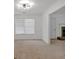 Bright living room with natural light, a stone fireplace, and seamless flow to dining and other living spaces at 2793 Saddle Horn, Snellville, GA 30039