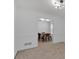 Open-concept living room flows into the dining area and features carpet floors and neutral color palette at 2793 Saddle Horn, Snellville, GA 30039