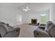 Open living space with fireplace and large windows offering natural light at 2793 Saddle Horn, Snellville, GA 30039