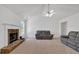 Bright living room with a stone fireplace and comfortable seating at 2793 Saddle Horn, Snellville, GA 30039