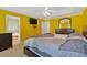 Main bedroom showcasing yellow walls, TV and ensuite bathroom entrance at 2793 Saddle Horn, Snellville, GA 30039