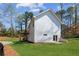 Exterior view of the house with a small deck, backyard, and siding at 3143 Lee Cir, Buford, GA 30518