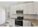 Well-equipped kitchen featuring stainless steel appliances, granite counters, and white subway tile backsplash at 3143 Lee Cir, Buford, GA 30518