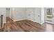 Upstairs living room featuring a storage closet, hardwood floors, and access to an outdoor deck at 3143 Lee Cir, Buford, GA 30518