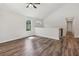 Spacious living room with hardwood floors, natural light, and an open layout leading to the staircase at 3143 Lee Cir, Buford, GA 30518