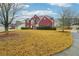 Charming red brick home with mature trees and a sprawling front yard in a desirable neighborhood at 4419 Bellwood Cir, Atlanta, GA 30349