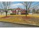 Beautiful red brick two-story home with mature trees and lush landscaping in a quiet neighborhood at 4419 Bellwood Cir, Atlanta, GA 30349