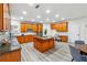 Well-lit kitchen with wood cabinets, stainless steel appliances, and a spacious island at 4419 Bellwood Cir, Atlanta, GA 30349