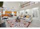 Expansive living room connects to the open-concept kitchen and features high ceilings and a fireplace at 4419 Bellwood Cir, Atlanta, GA 30349