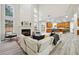 Bright and spacious living room with soaring ceilings, fireplace, and open floor plan to the kitchen at 4419 Bellwood Cir, Atlanta, GA 30349
