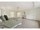 Generously-sized Primary bedroom features tray ceilings and a large area for seating or work at 4419 Bellwood Cir, Atlanta, GA 30349
