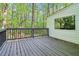 Spacious deck great for outdoor entertaining, surrounded by a lush green forest and home exterior at 2100 Kings Valley Dr, Lawrenceville, GA 30043