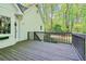 Spacious deck great for outdoor entertaining, surrounded by a lush green forest at 2100 Kings Valley Dr, Lawrenceville, GA 30043