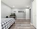 Spacious bedroom with modern flooring, neutral walls, and plenty of natural light at 2100 Kings Valley Dr, Lawrenceville, GA 30043