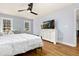 Bedroom with hardwood floors, flat screen tv, and sitting area, great for relaxing at 2100 Kings Valley Dr, Lawrenceville, GA 30043