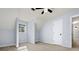 Bonus room featuring light blue walls, dormer window, neutral carpet, and access to an adjacent room at 2100 Kings Valley Dr, Lawrenceville, GA 30043