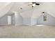 Spacious bonus room with light blue walls, neutral carpet, dormer window, and plenty of natural light at 2100 Kings Valley Dr, Lawrenceville, GA 30043