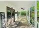 Charming front porch with swing, ceiling fans and decorative welcome sign at 2100 Kings Valley Dr, Lawrenceville, GA 30043