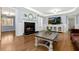 Spacious living room featuring a fireplace, tv cabinet, hardwood floors and lots of natural light at 2100 Kings Valley Dr, Lawrenceville, GA 30043