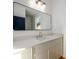 Bathroom with a white vanity, large mirror, and stylish lighting at 2526 Abner Nw Pl, Atlanta, GA 30318