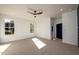 Bright bedroom with a ceiling fan and an adjacent door at 2526 Abner Nw Pl, Atlanta, GA 30318