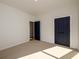 Bedroom featuring neutral carpet and a navy interior door and closet at 2526 Abner Nw Pl, Atlanta, GA 30318