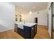 Bright, open-concept kitchen features a large island with seating and stainless steel appliances at 2526 Abner Nw Pl, Atlanta, GA 30318