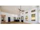 Open concept living area features hardwood floors, high ceilings, modern fixtures and a partial kitchen view at 2526 Abner Nw Pl, Atlanta, GA 30318