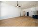 Open and airy living space featuring hardwood floors and high ceilings with a partial kitchen view at 2526 Abner Nw Pl, Atlanta, GA 30318