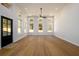 Bright living room featuring hardwood floors, a black fan, and lots of natural light through windows at 2526 Abner Nw Pl, Atlanta, GA 30318