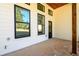 Covered patio with stylish black framed windows and wood beam accents at 2526 Abner Nw Pl, Atlanta, GA 30318