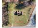 Aerial view showcasing the property's 1.61 acres, surrounded by trees at 3415 Spot Rd, Cumming, GA 30040