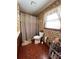 Classic bathroom featuring floral wallpaper and a shower-tub combination at 3415 Spot Rd, Cumming, GA 30040