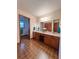 Large bathroom with double sink vanity, wood cabinets, and ample counter space at 3415 Spot Rd, Cumming, GA 30040