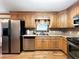 Kitchen with stainless steel appliances, cabinetry, and countertops at 3415 Spot Rd, Cumming, GA 30040