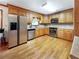 Well-lit kitchen boasts stainless steel appliances and ample cabinet space at 3415 Spot Rd, Cumming, GA 30040