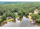 Beautiful lakefront property with mature trees, home and a private dock with space for your boat at 590 Yancey Cir, Covington, GA 30014