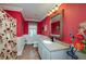 Red and white bathroom with floral shower curtain, decorative mirror, and vanity with solid surface top at 590 Yancey Cir, Covington, GA 30014