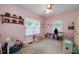 Pink bedroom with carpet, natural light, and an assortment of toys and decorations at 590 Yancey Cir, Covington, GA 30014