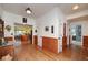 Hallway with wood paneling leading to kitchen at 590 Yancey Cir, Covington, GA 30014