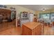 Bright kitchen featuring hardwood floors, island and eating area with lovely views of the outdoors at 590 Yancey Cir, Covington, GA 30014