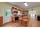 Open kitchen with an island, stainless steel appliances, and an exterior door at 590 Yancey Cir, Covington, GA 30014