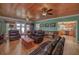 Spacious living room with hardwood floors, beamed ceiling, a seating area and lots of natural light at 590 Yancey Cir, Covington, GA 30014