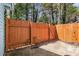 Backyard with a concrete pad and wood fence at 732 Jamestown Xing, Jonesboro, GA 30238