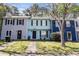 Charming townhome featuring a quaint front yard and a light blue facade with brown shutters at 732 Jamestown Xing, Jonesboro, GA 30238