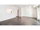 Open-concept room with vinyl flooring, bright natural light, and neutral walls, great for entertaining or relaxing at 732 Jamestown Xing, Jonesboro, GA 30238